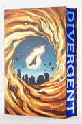 An unmissable, hardcover deluxe limited edition of DIVERGENT, the first book in Veronica Roth's bestselling Divergent series. Features a stunning, completely foiled case, shimmering unique endpapers, a metallic reimagined cover, gorgeous designed edges, and bonus exclusive content. Now at MPHOnline.com.